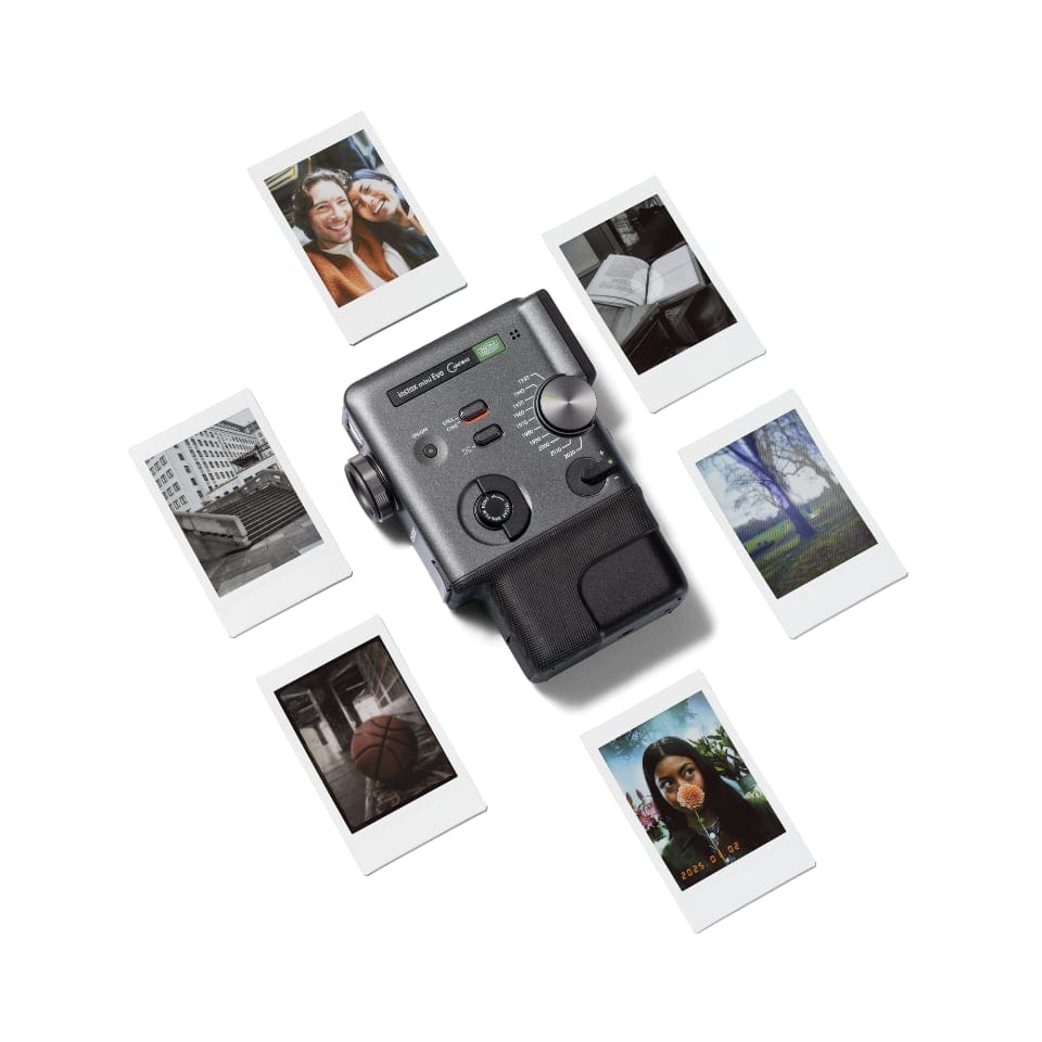 Fujifilm instax mini Evo Cinema surrounded by various printed photos, illustrating its instant print capability.