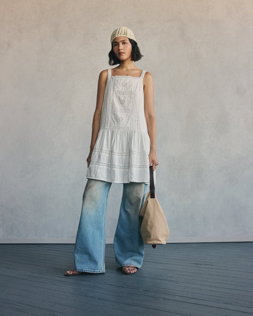Model in a white dress top with wide-leg jeans from Levi's Spring Summer 2026 collection.