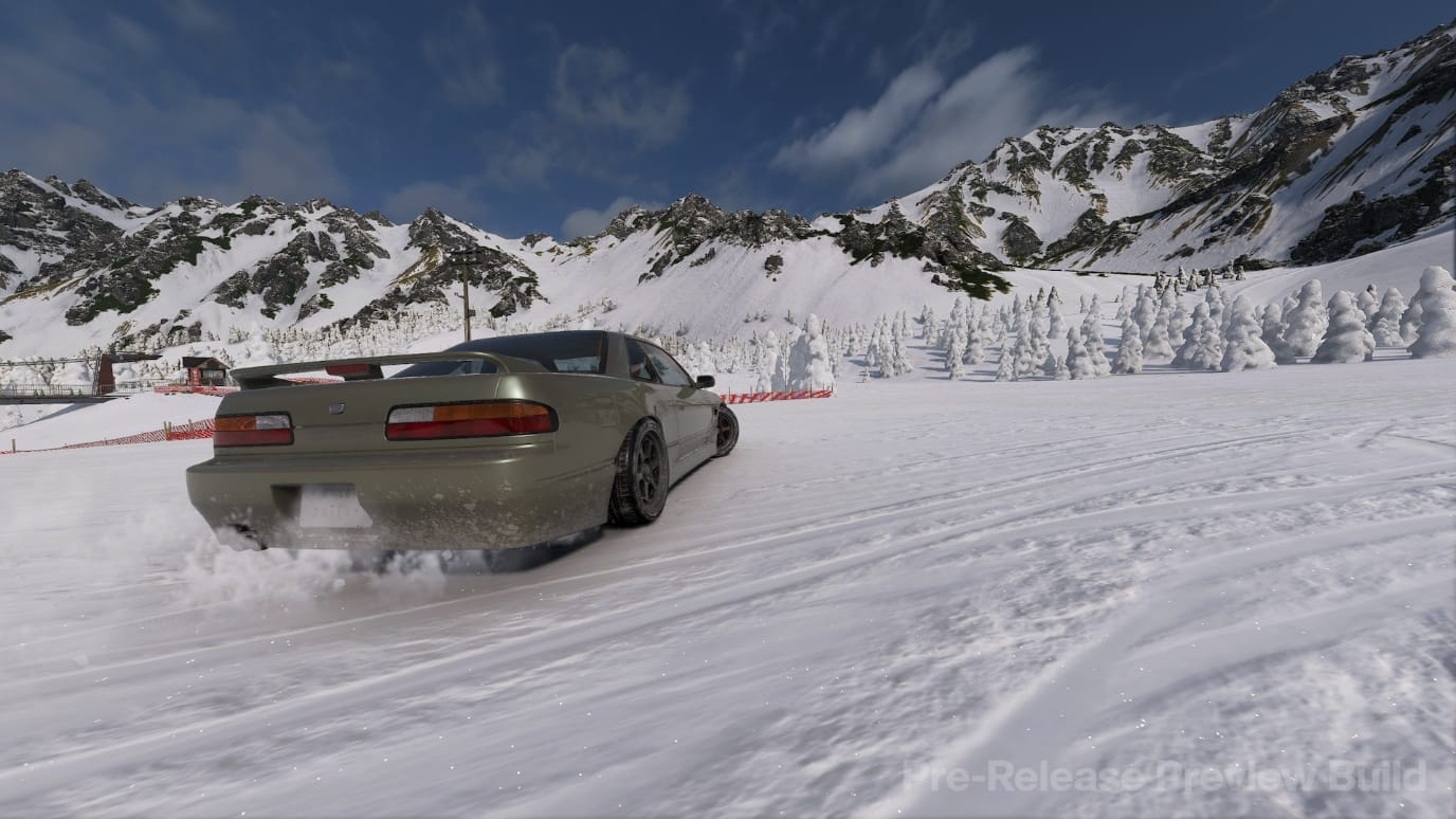Sport car drifting on snowy terrain with mountains in the background in Forza Horizon 6.