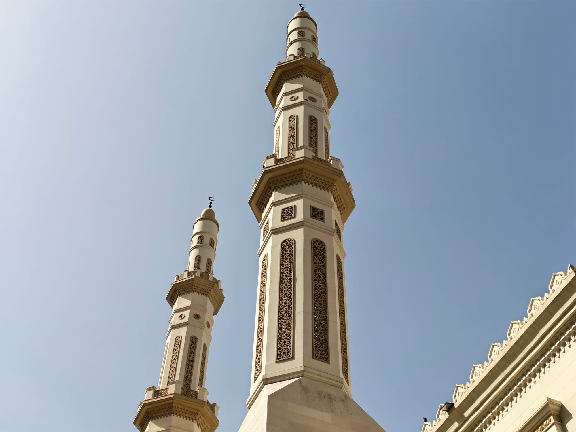 Close-up of mosque minarets showcasing intricate designs and architectural details.
