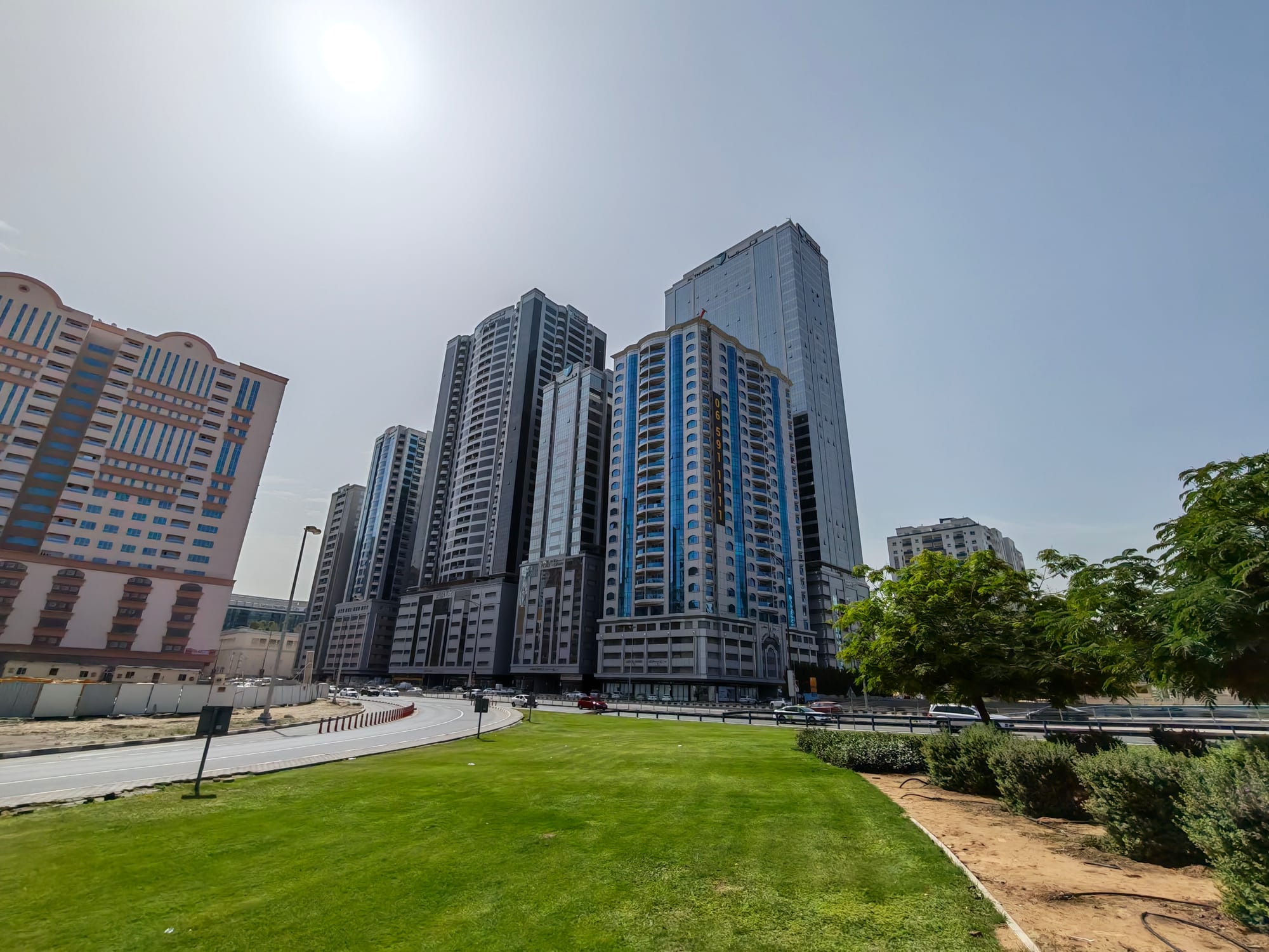 Honor 600 Pro with camera features displayed on its screen in a well-lit environment.