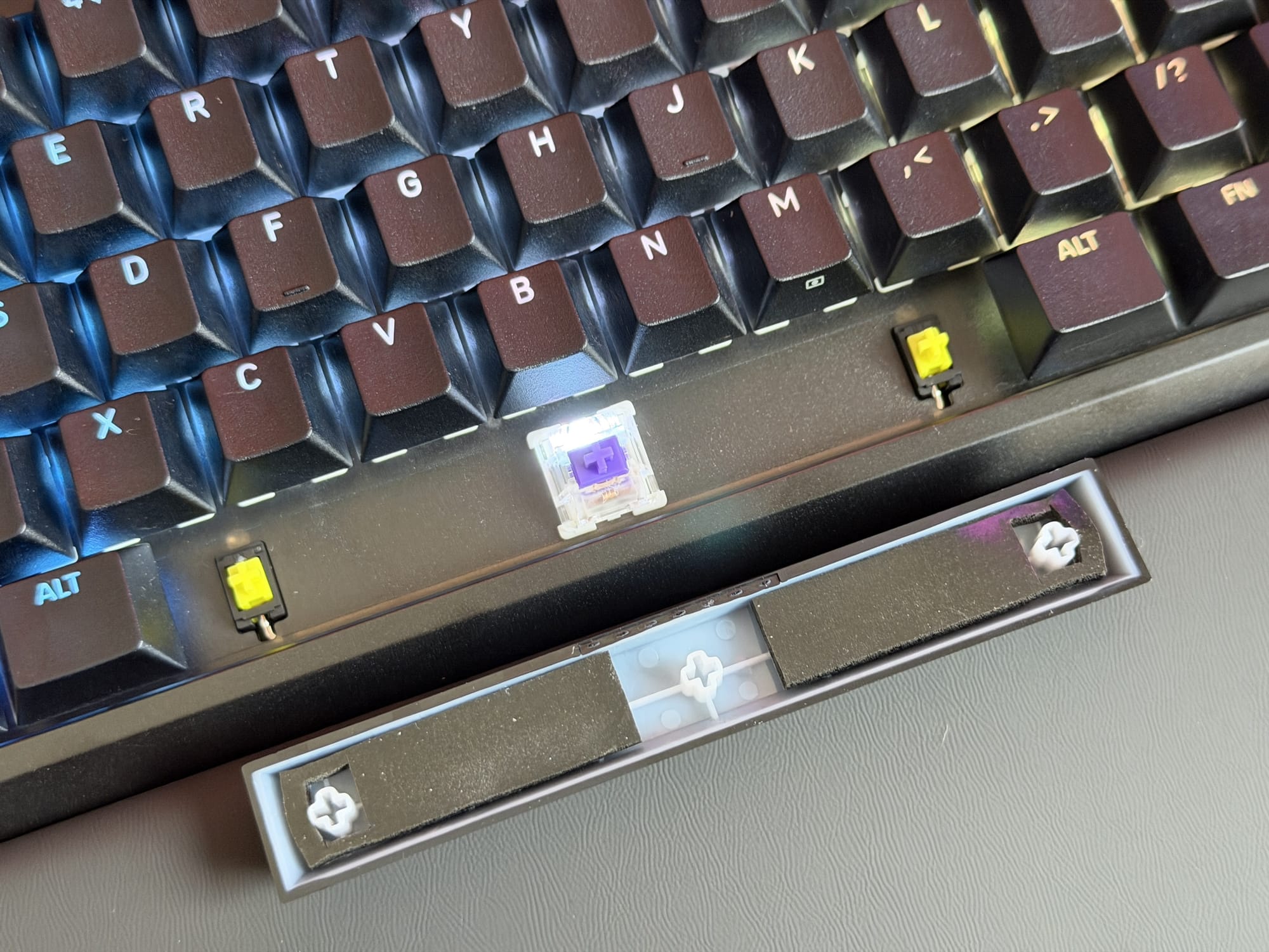 Close-up of mechanical keyboard with removed keycap and switch for Corsair Galleon 100 SD.