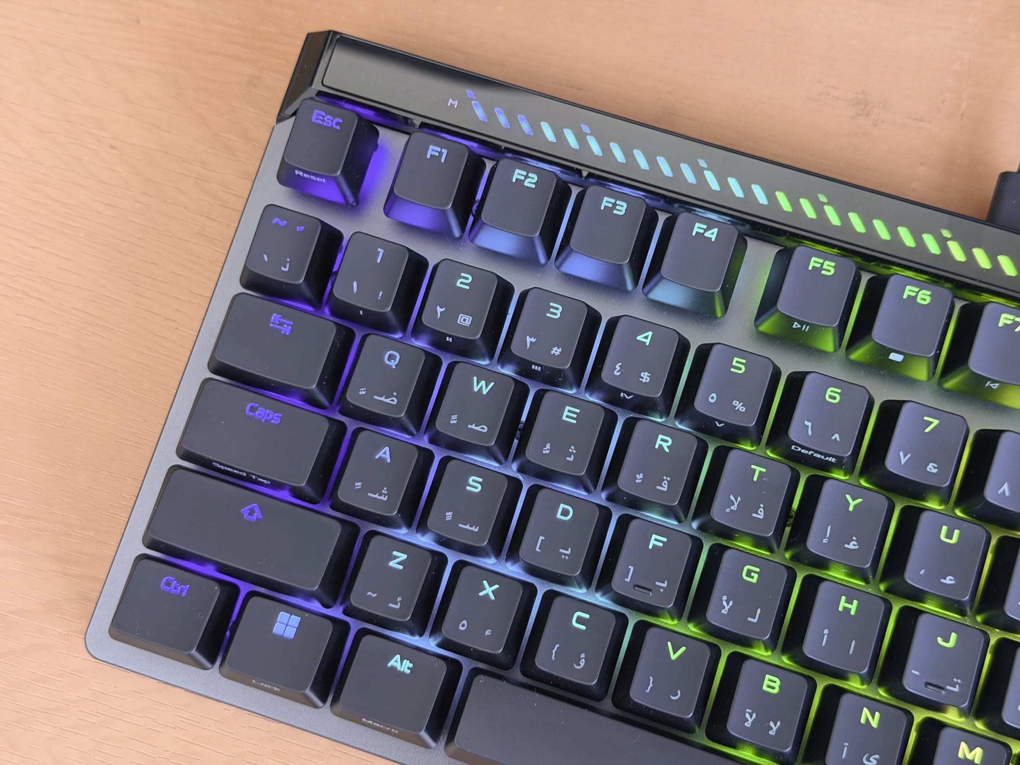 Close-up of ASUS ROG Falchion Ace keyboard with RGB lighting on keys.