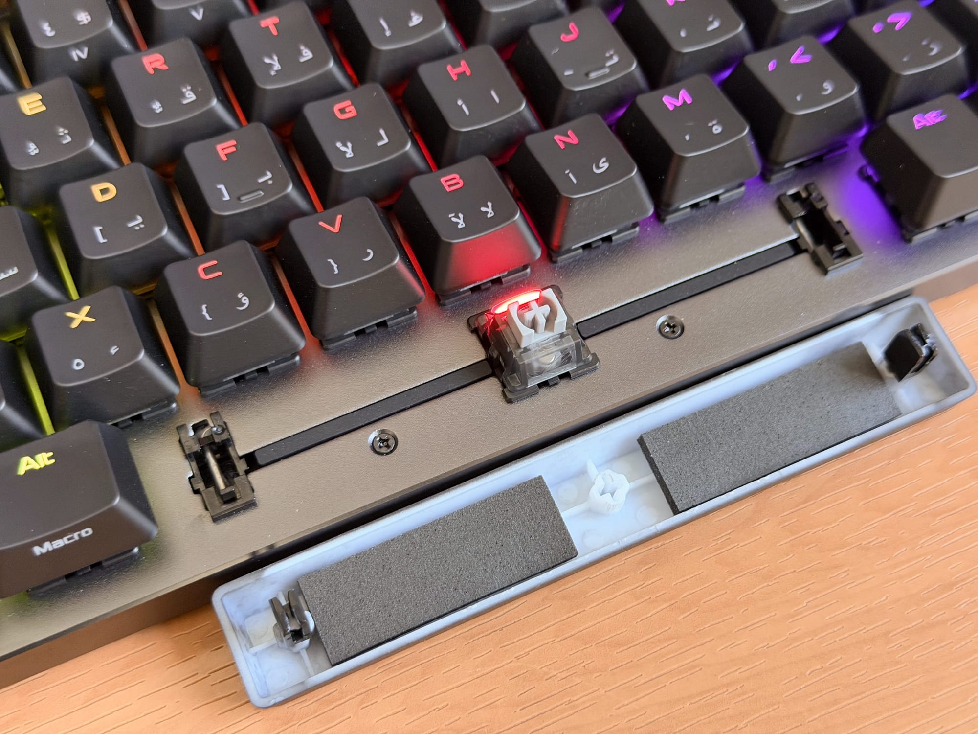 Showcasing key switch mechanism of ASUS ROG Falchion Ace keyboard.