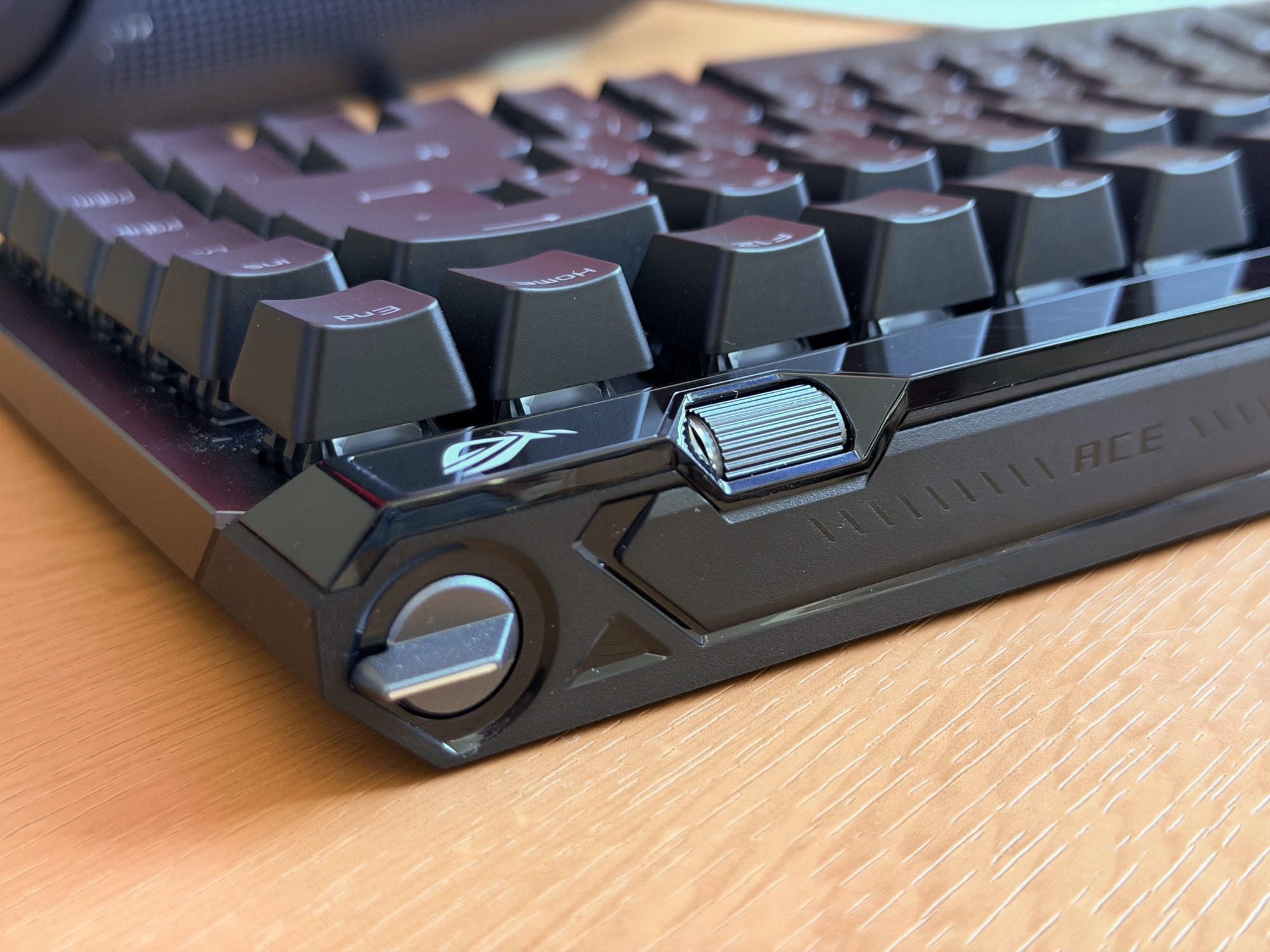 Side view of ASUS ROG Falchion Ace keyboard showing volume knob.