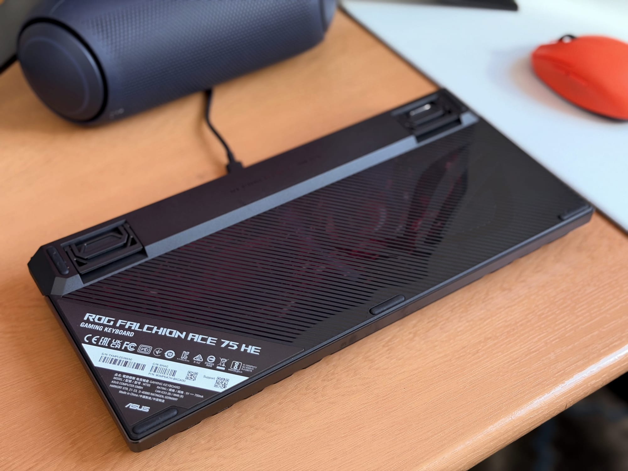 Bottom view of ASUS ROG Falchion Ace keyboard displaying branding and features.