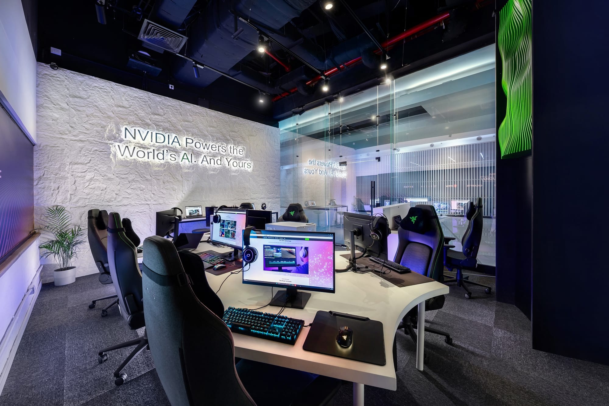 Creative workspace featuring NVIDIA branding, desks with computers, and modern design.