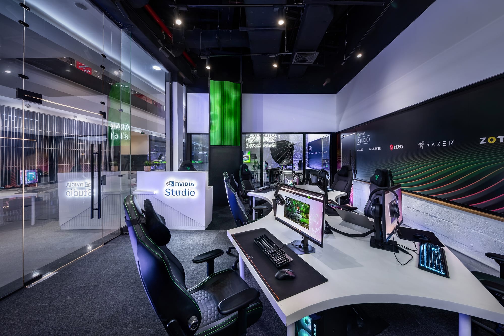 Inside NVIDIA Studio Space with gaming PCs and dual monitors setup for creators.