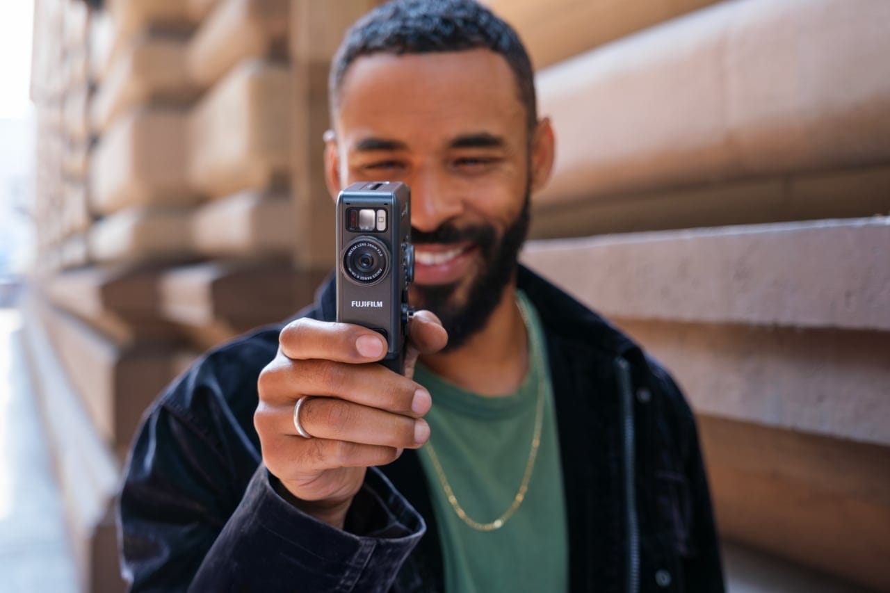 Close-up of the Fujifilm instax mini Evo Cinema showing its button layout and features.