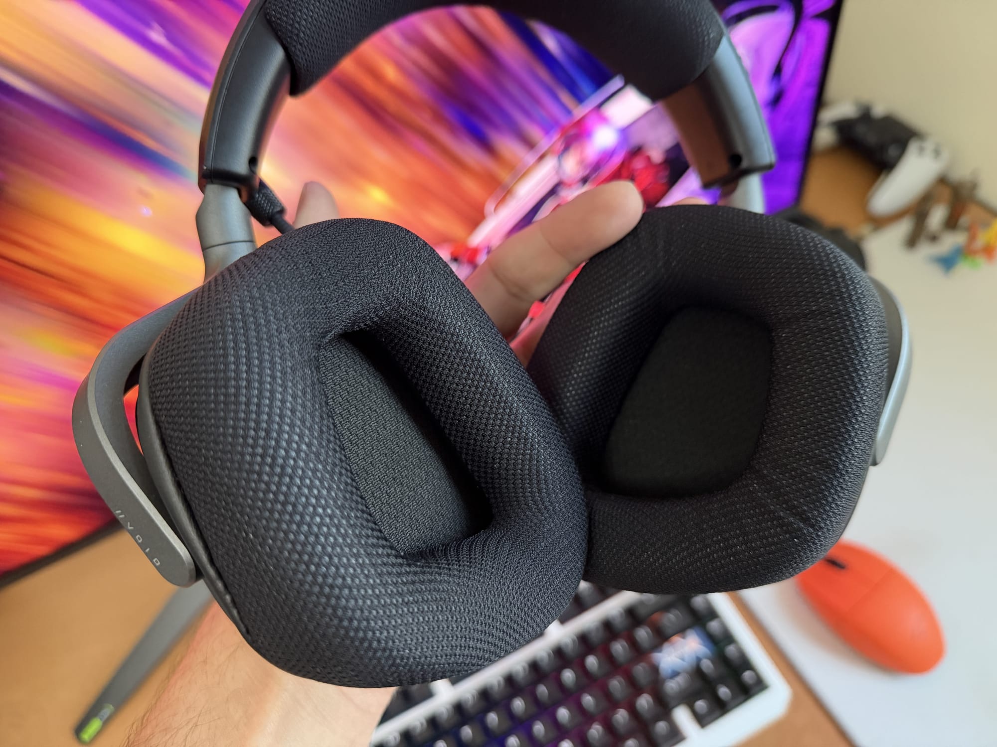 Close-up of Corsair Void v2 MAX ear pads, showcasing texture and padding.