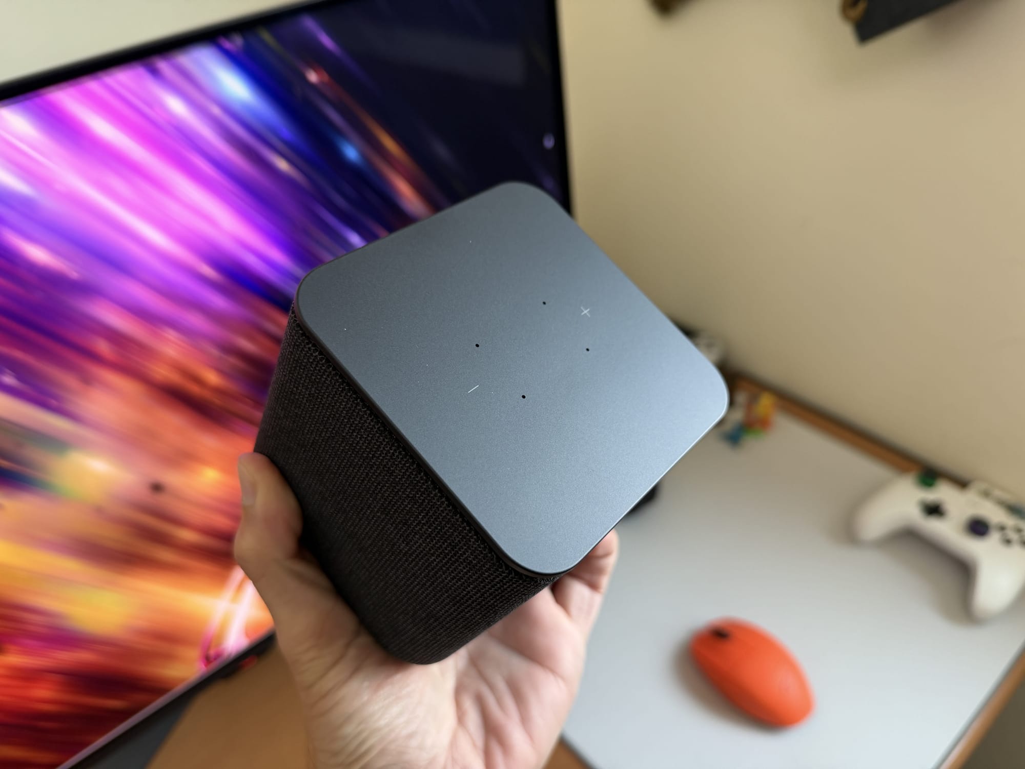 Top view of Yasmina Midi smart speaker showing control buttons.
