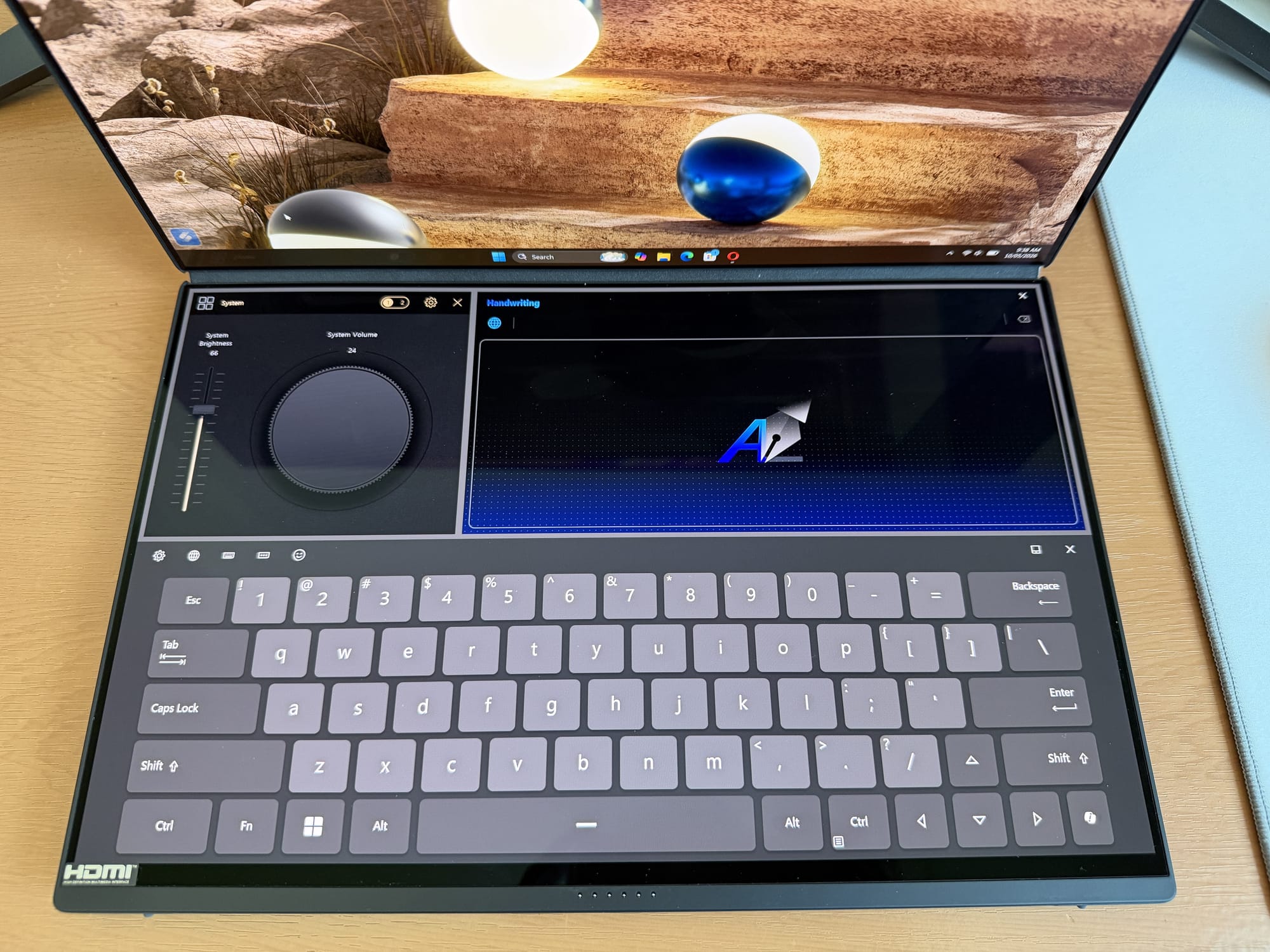 Asus ZenBook Duo 2026 dual-screen setup showing touchpad and touchscreen features.