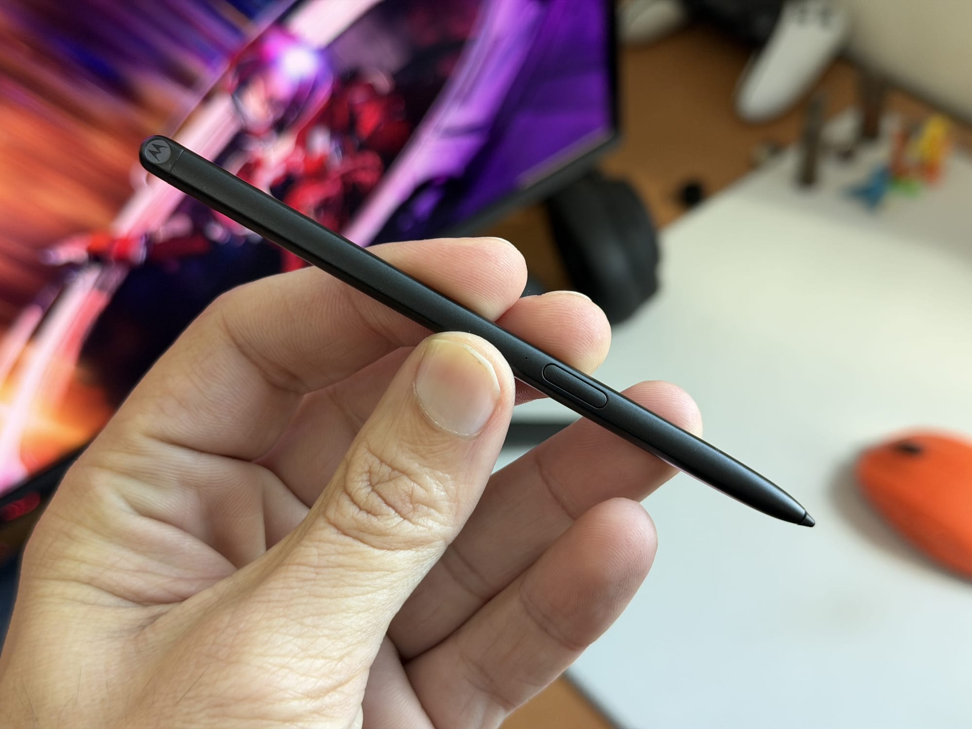 Close-up of Motorola stylus pen showcasing its sleek design and button.
