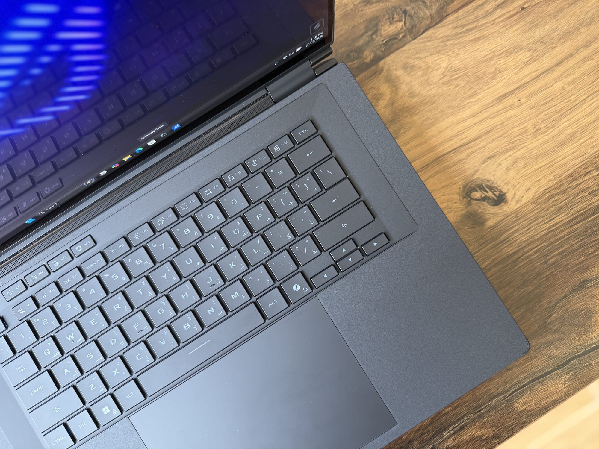 The keyboard deck with single-zone RGB lighting and the trackpad
