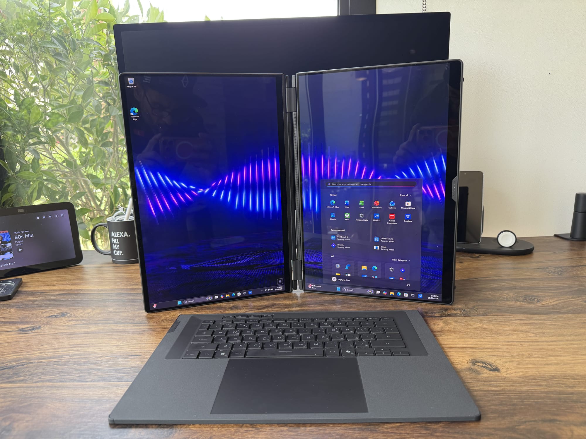 Dual screens stacked vertically with the detachable keyboard placed in front