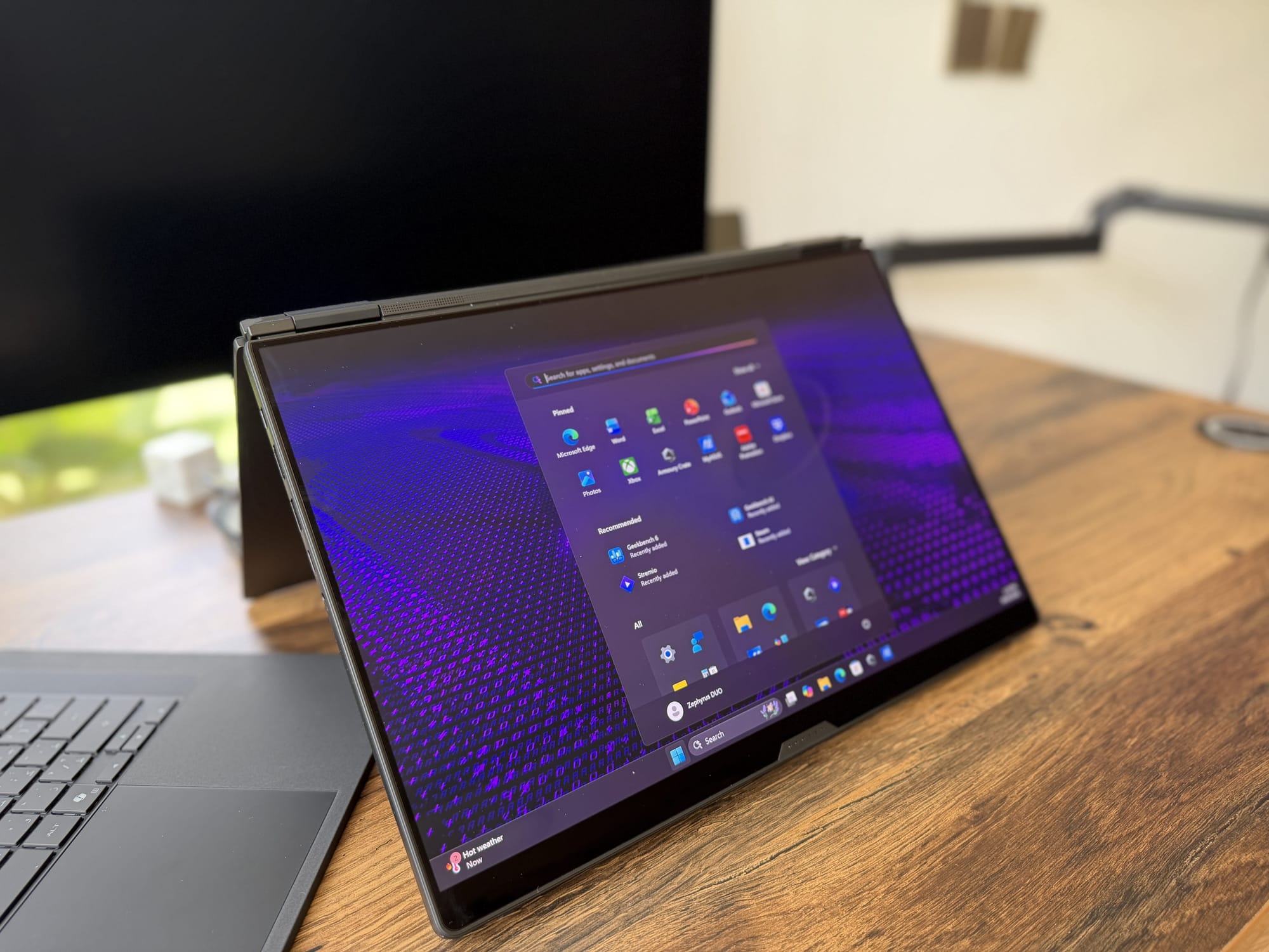 The Zephyrus Duo with its display reclined nearly flat, one of five usage modes