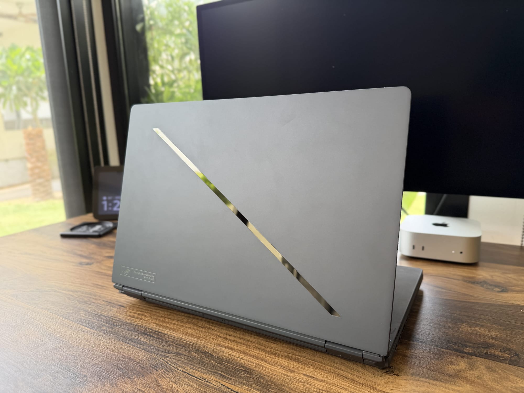 Asus ROG Zephyrus Duo 2026 closed, showing the glossy diagonal slash and ROG logo on the Stellar Gray lid