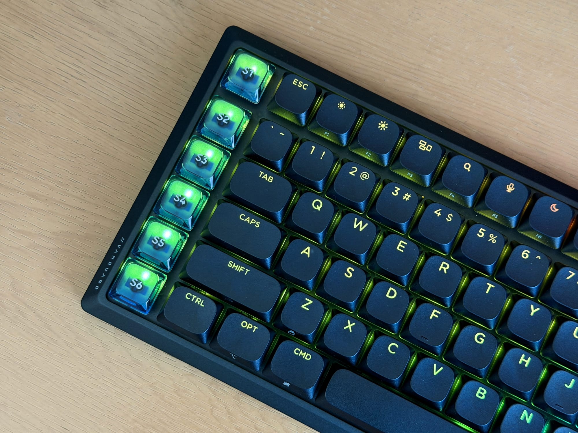 Top view of Corsair Vanguard Air 99 keyboard showcasing green LED backlighting on keys.