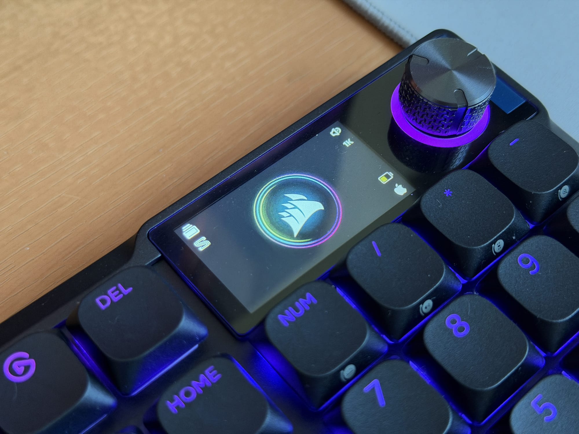 Close-up of Corsair Vanguard Air 99's customizable display showing Corsair logo and controls.