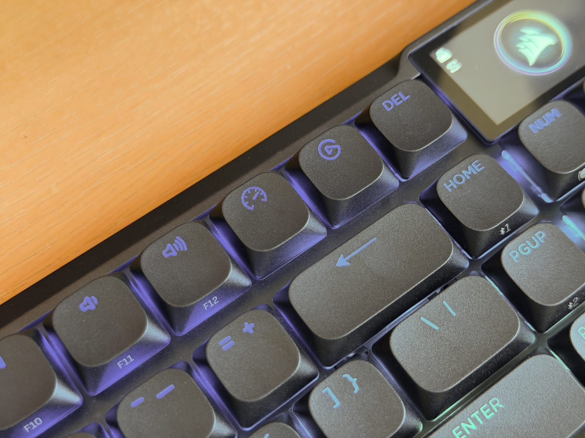 Close-up of Corsair Vanguard Air 99 keyboard keys, highlighting backlit function keys and media controls.