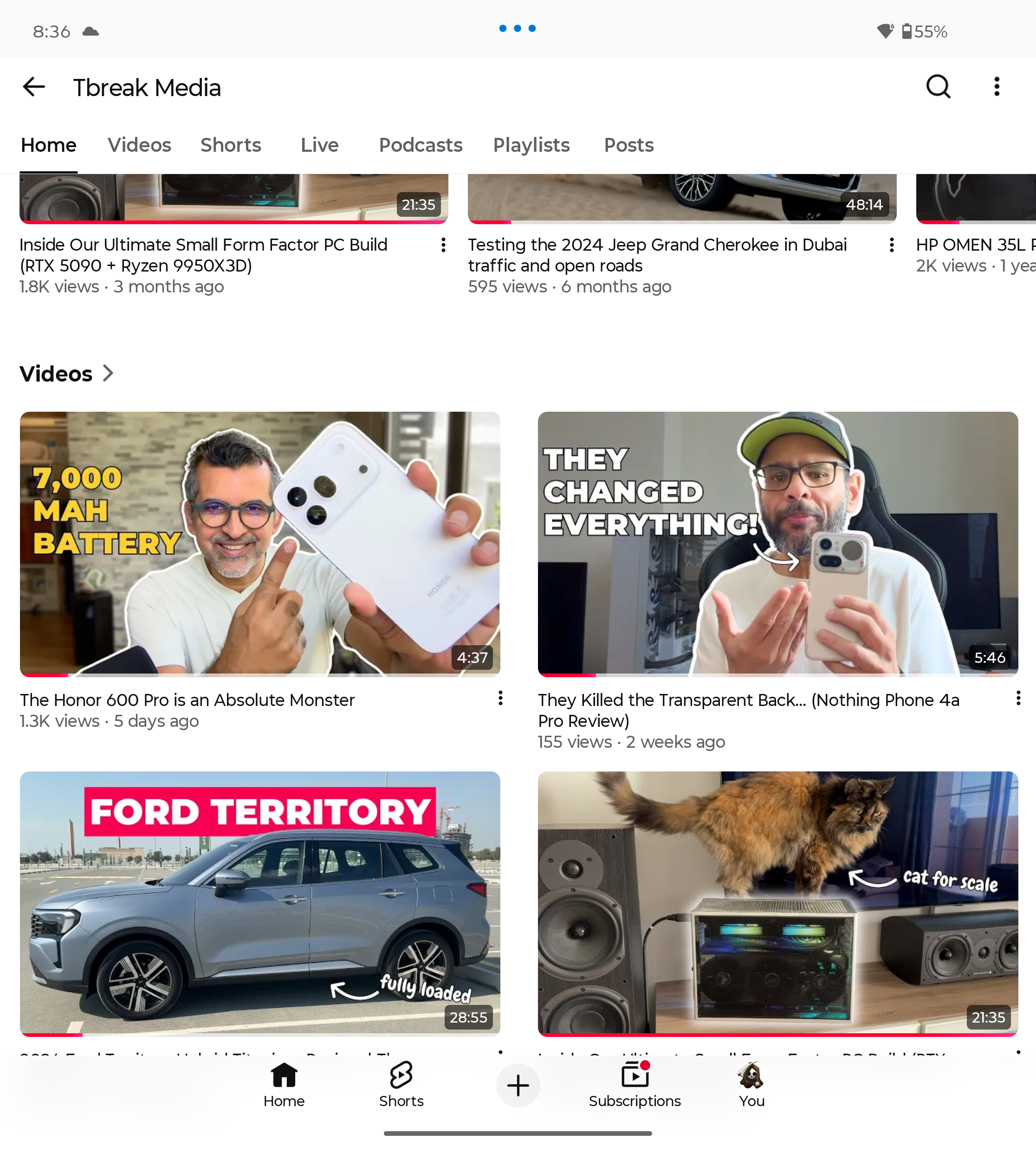 YouTube app on Motorola Razr Fold showing video thumbnails and durations.