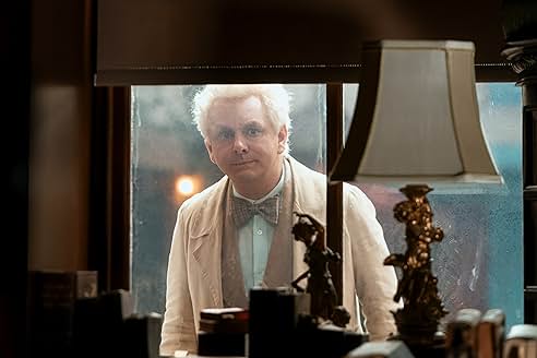 Crowley and Aziraphale in a tense moment, showcasing their contrasting styles.