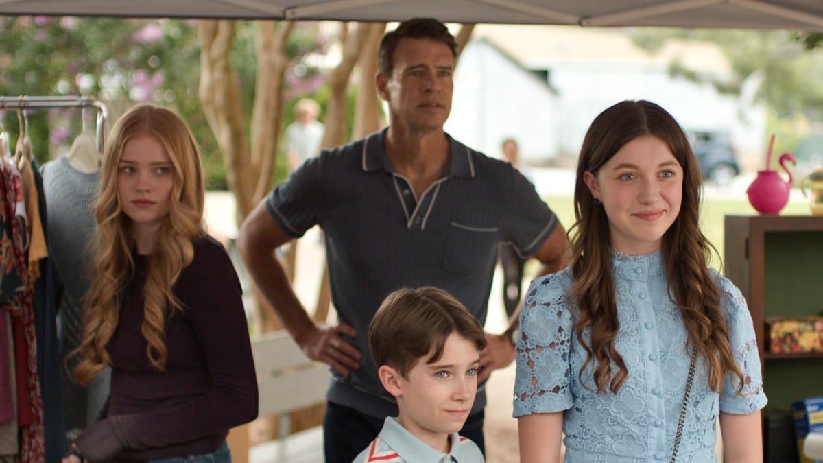 Scott Foley interacting with three children at a market.