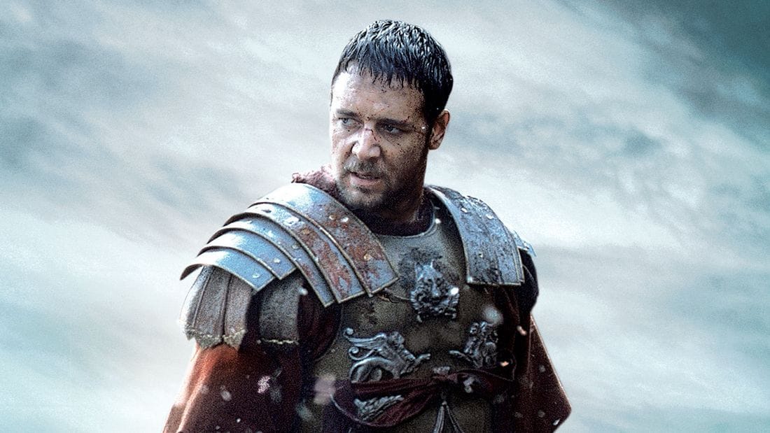 Russell Crowe as Maximus in Gladiator, wearing armor and displaying a determined expression.