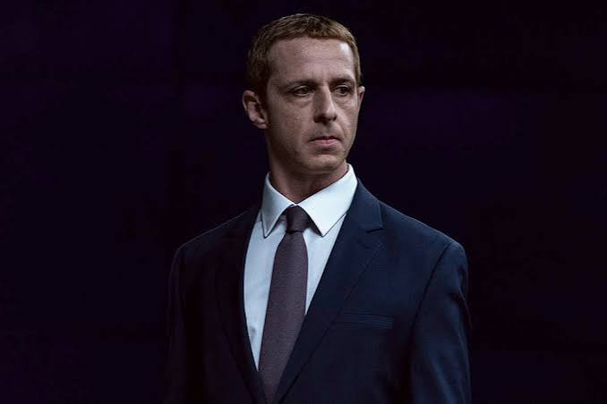 Jeremy, a character, poses in formal attire at a public event.