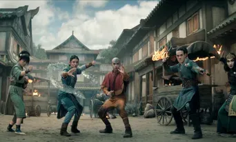 A group of characters, including Aang, showcase elemental bending in an ancient town setting.