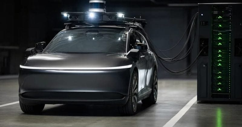 Autonomous vehicle with sensors connected to a charging station in a dark warehouse