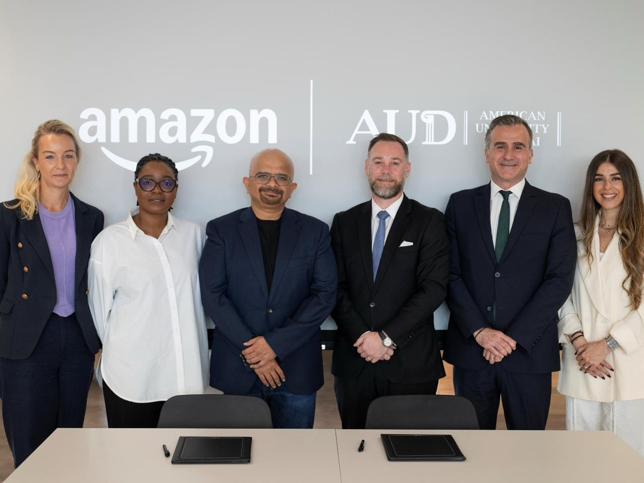 Amazon and American University in Dubai executives at a signing ceremony for their talent programme