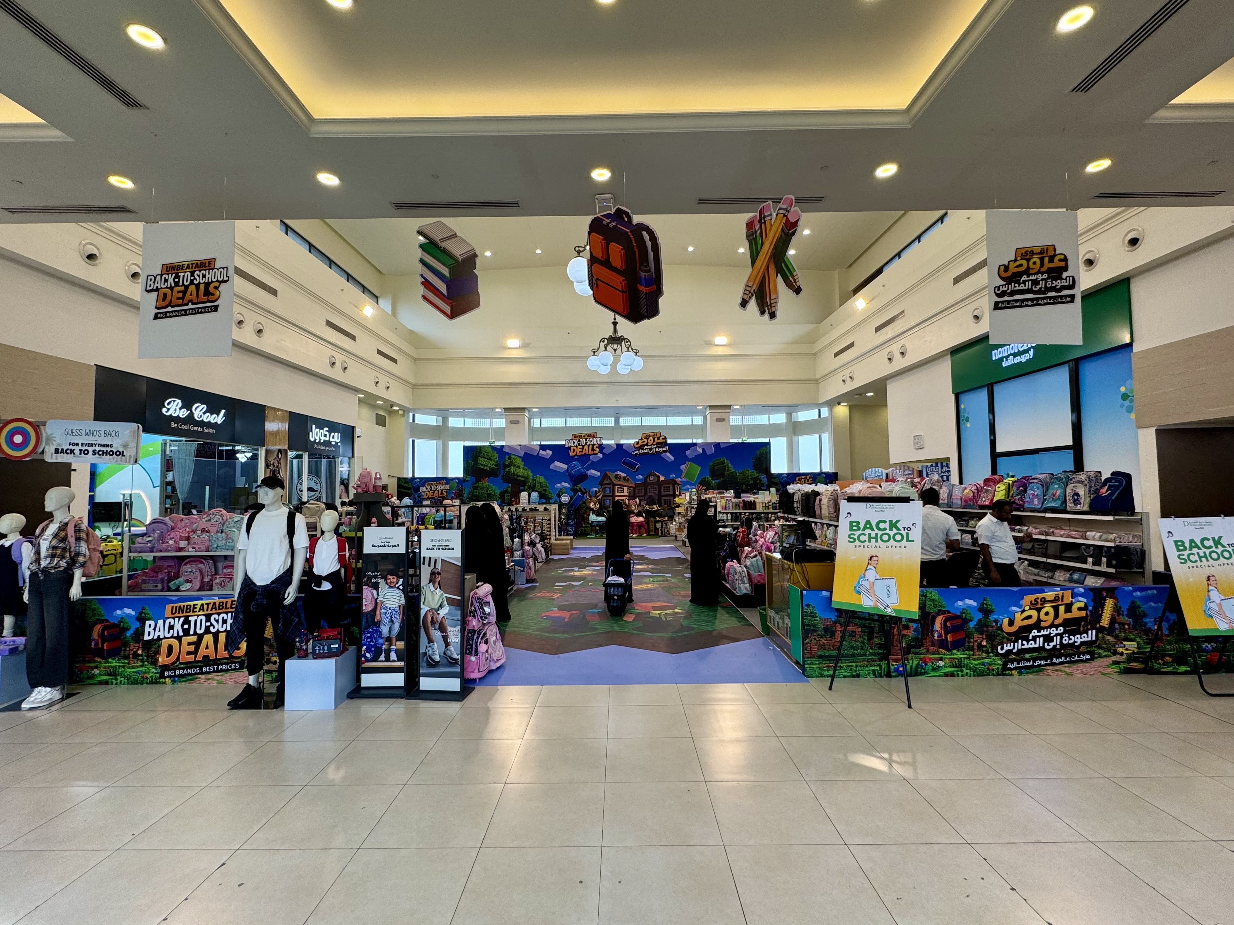 Deerfields Mall summer campaign artwork for back-to-school offers and Abu Dhabi attraction raffle