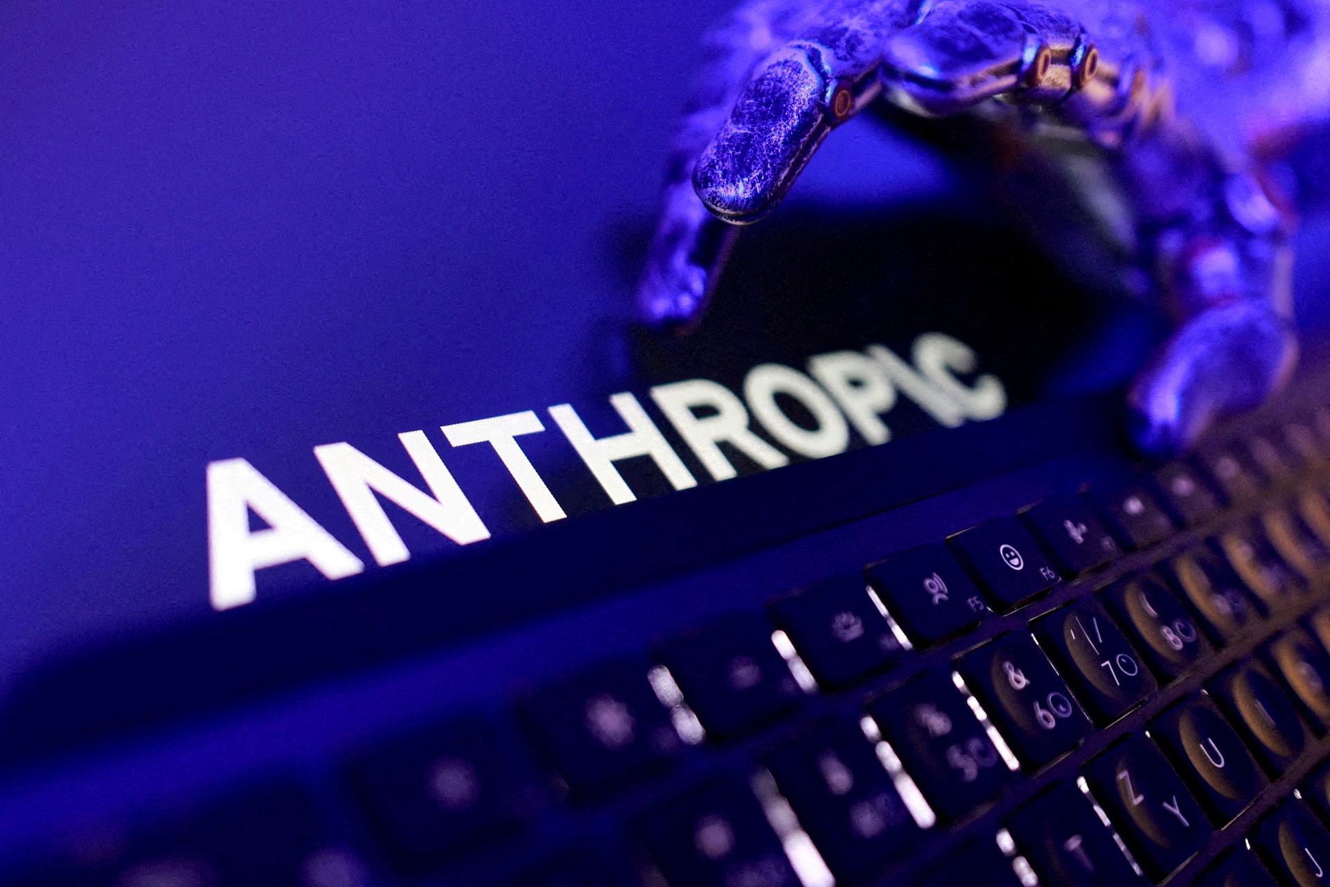 Reuters illustration of the Anthropic logo with a keyboard and robotic hand