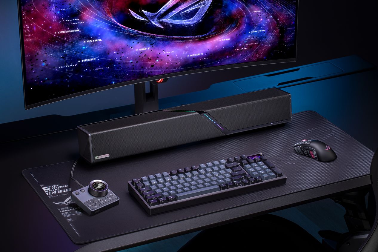 The ASUS ROG Gjallar gaming soundbar with its wireless subwoofer on a desk