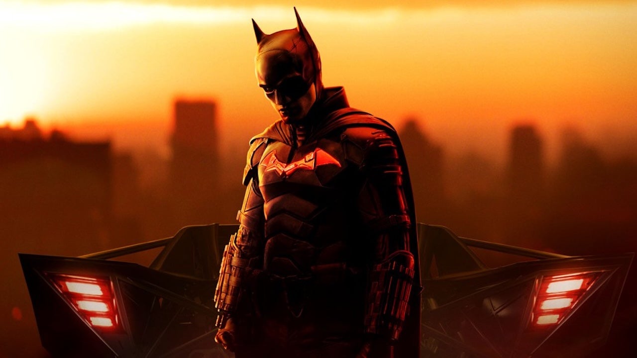 Robert Pattinson as Batman with the Batmobile's rear wings glowing in key art for The Batman