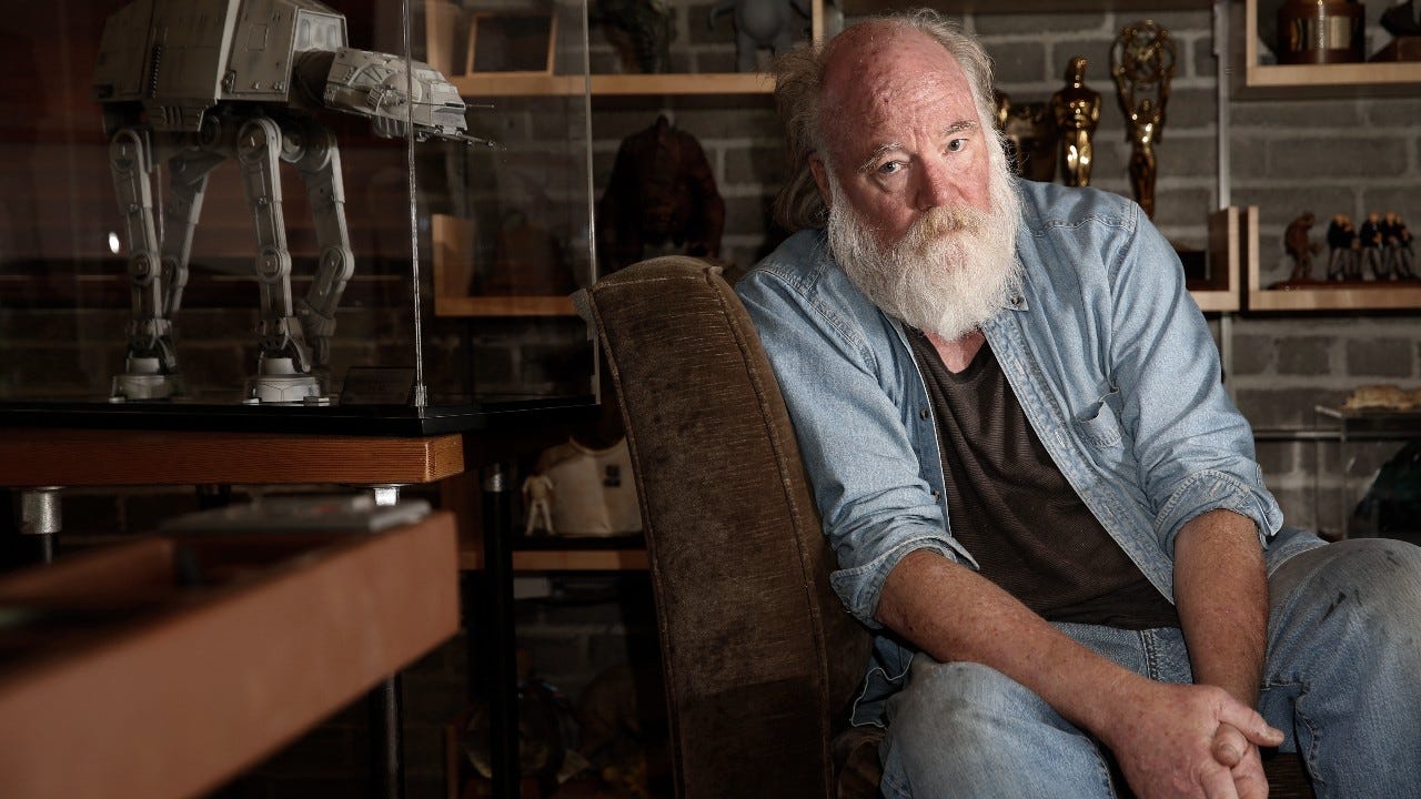 Phil Tippett beside an AT-AT model in his Berkeley studio