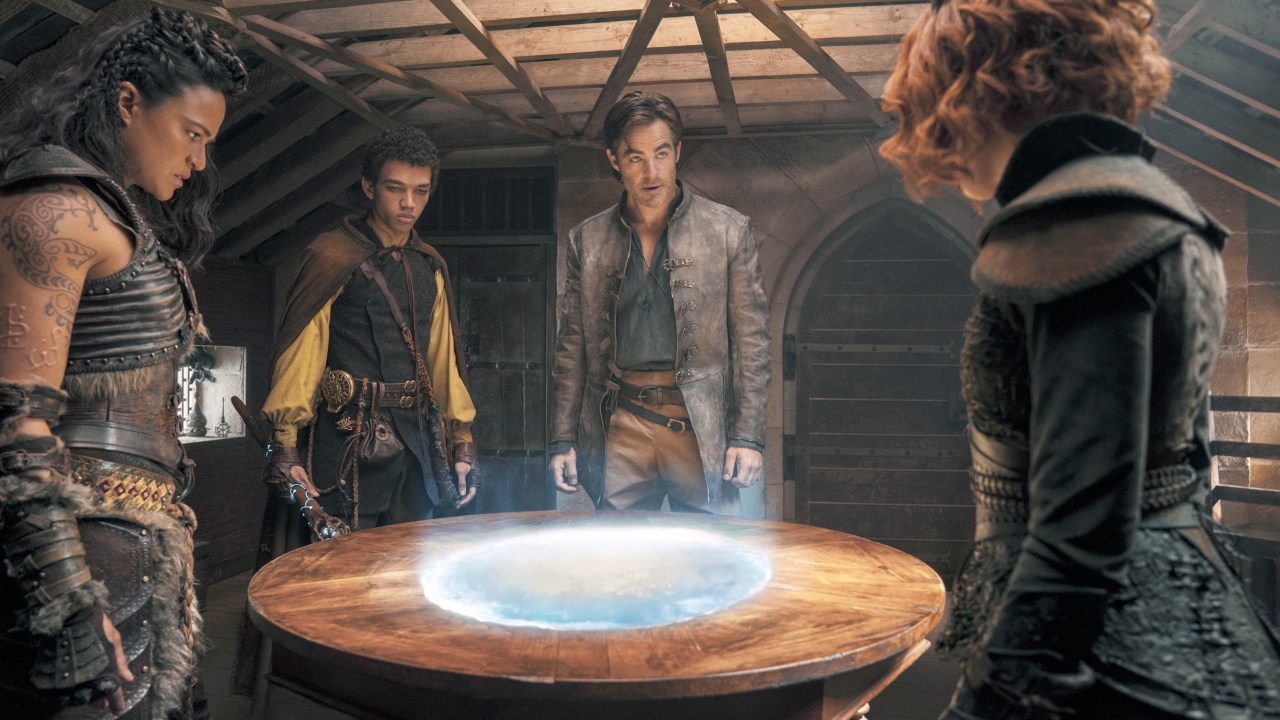 Dungeons & Dragons Honor Among Thieves heroes gather around a magical orb
