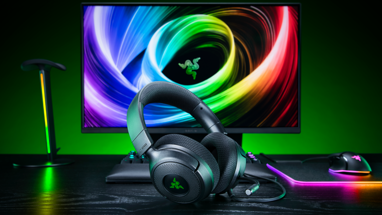 Razer Kraken V4 X Sensa HD Haptics headset on a gaming desk